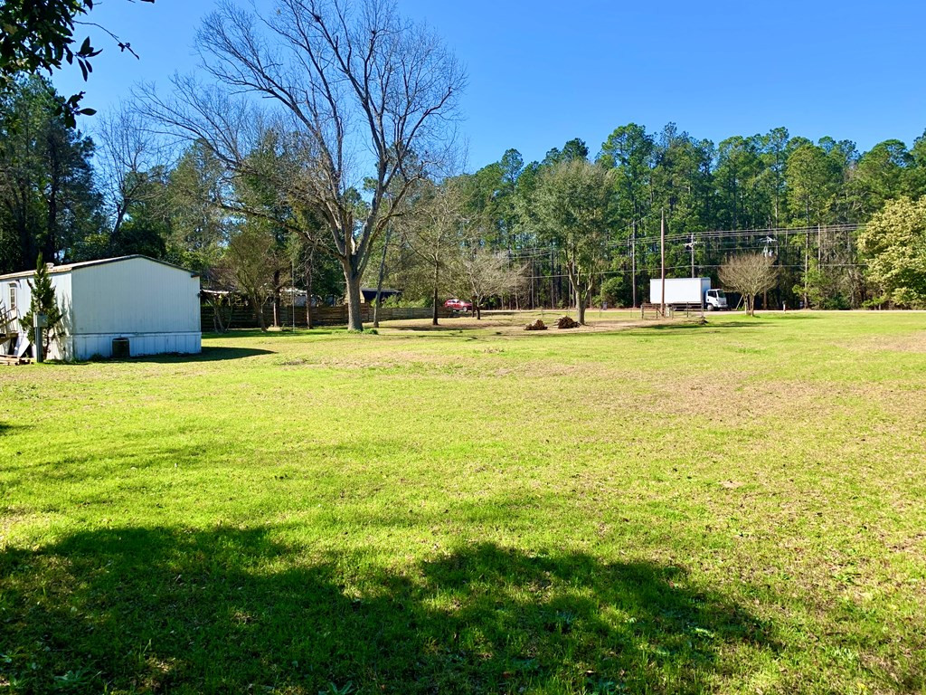4992 Whiskey Road Aiken, SC 29803 - Photo 4 of 9 a view of a swimming pool with an outdoor space and seating area