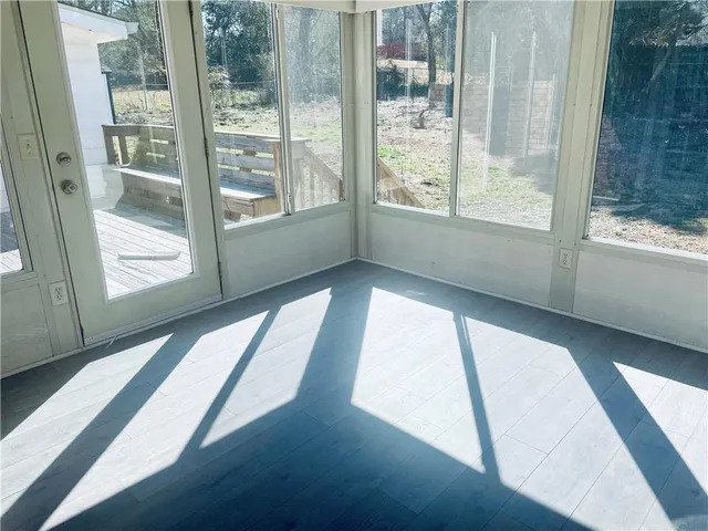 a view of an empty room and window