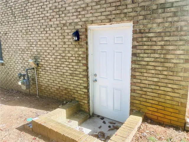 a bathroom with a wooden toilet