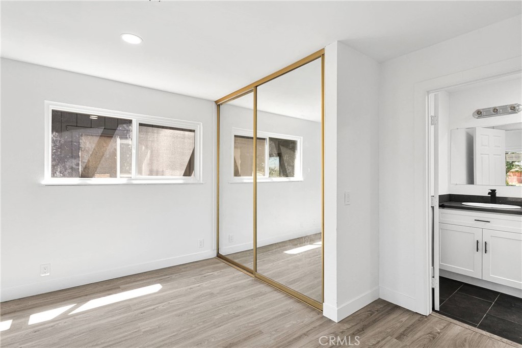 14855 Flathead Road Apple Valley, CA 92307 - Photo 7 of 14 a view of a room with wooden floor and cabinet