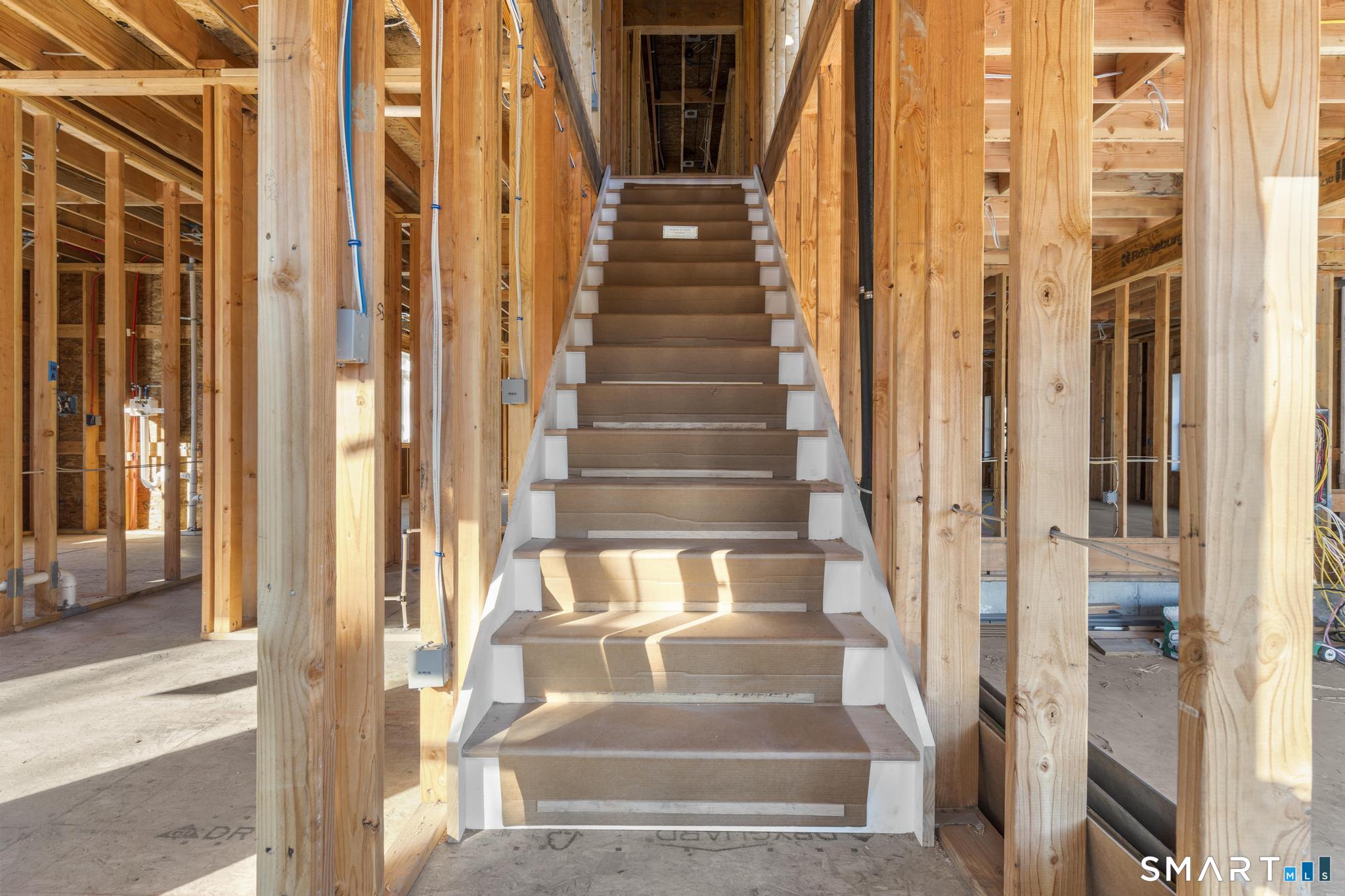 154 B Long Meadow Hill Road Brookfield, CT 06804 - Photo 16 of 37 a view of staircase with white walls and windows