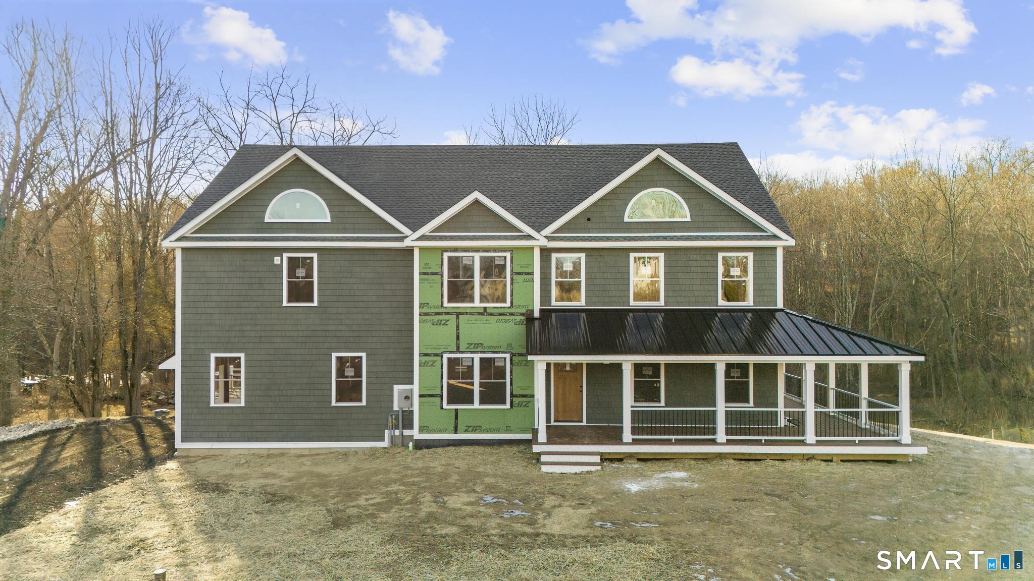 154 B Long Meadow Hill Road Brookfield, CT 06804 - Photo 29 of 37 a front view of a house with a garden