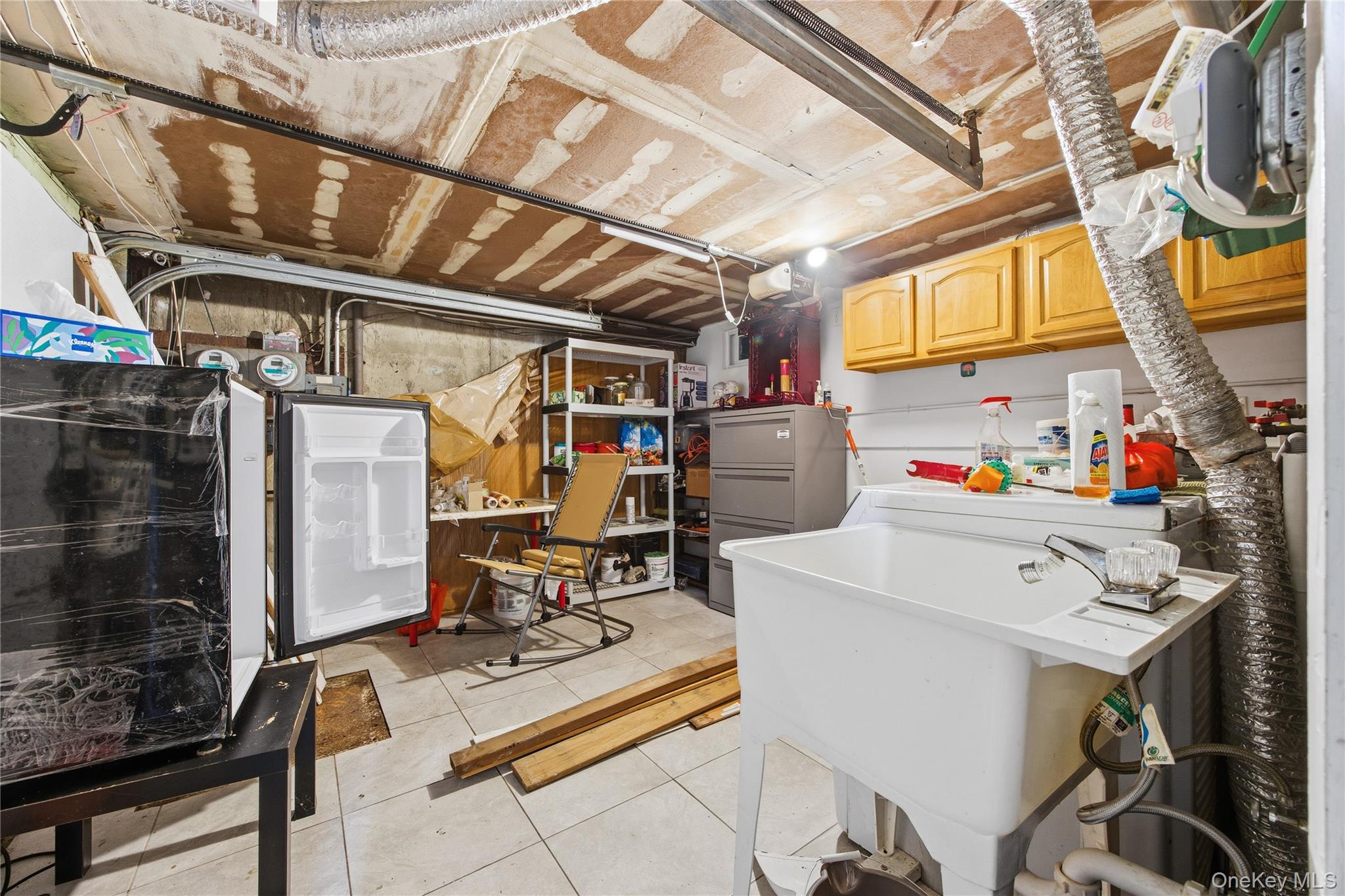 5-37 117th Street Queens, NY 11356 - Photo 22 of 28 a utility room with dryer and washer