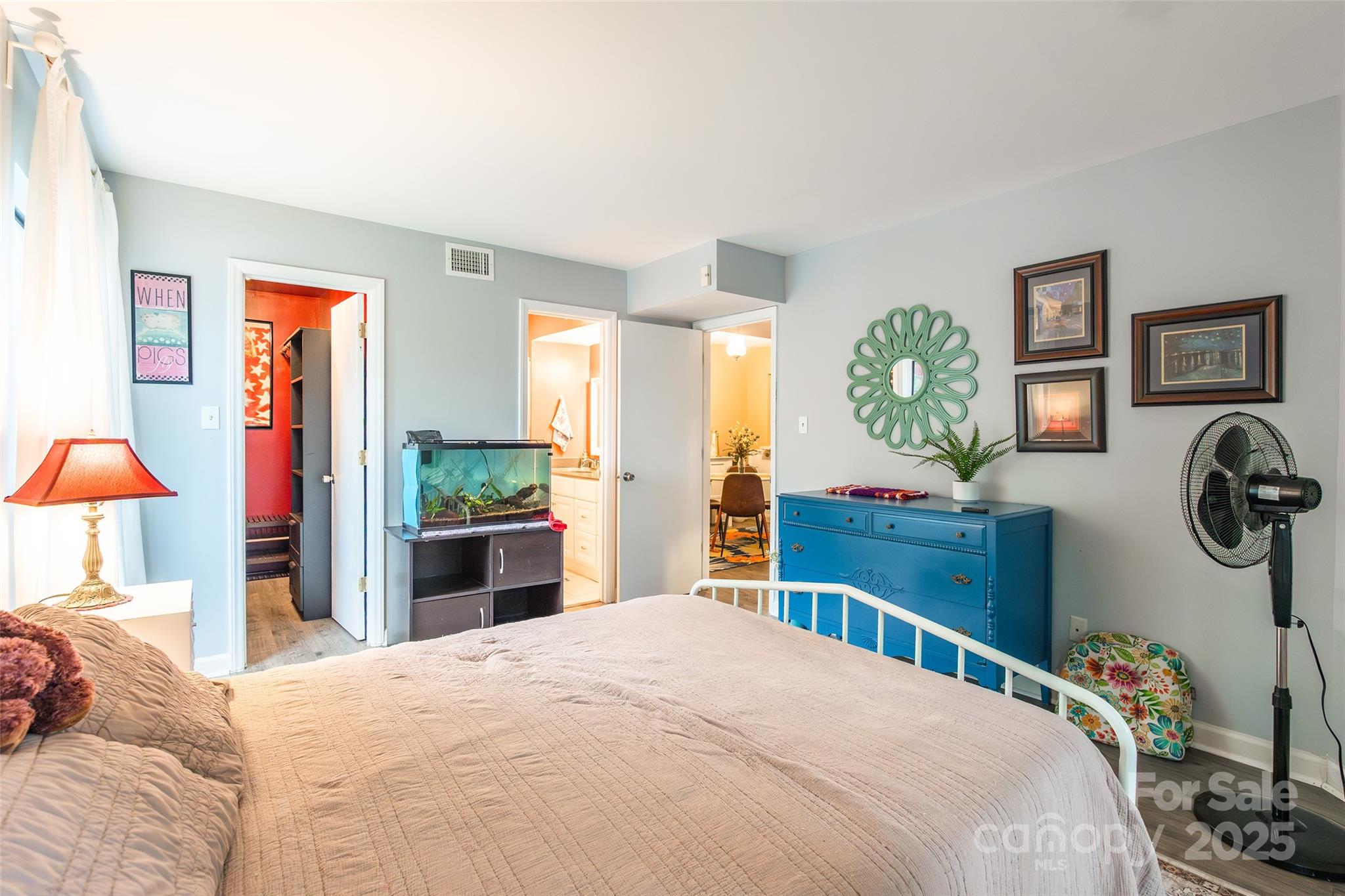 1604 Sharon Road West, Unit 23 Charlotte, NC 28210 - Photo 17 of 21 a bedroom with a bed a mirror and a window