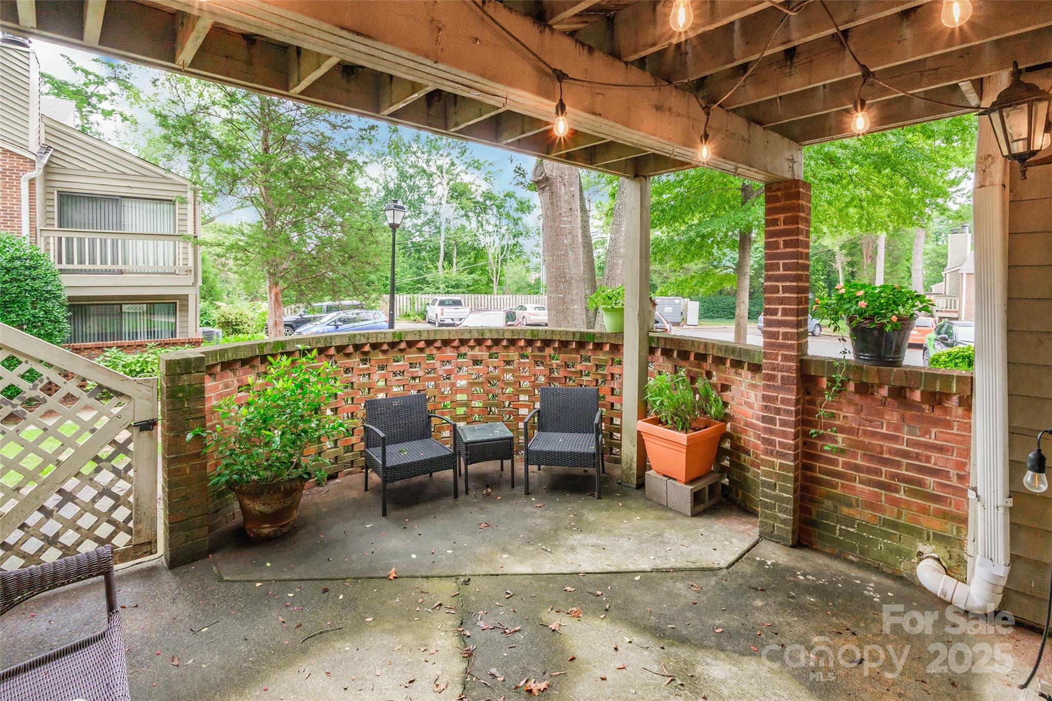1604 Sharon Road West, Unit 23 Charlotte, NC 28210 - Photo 5 of 21 a view of garden with patio