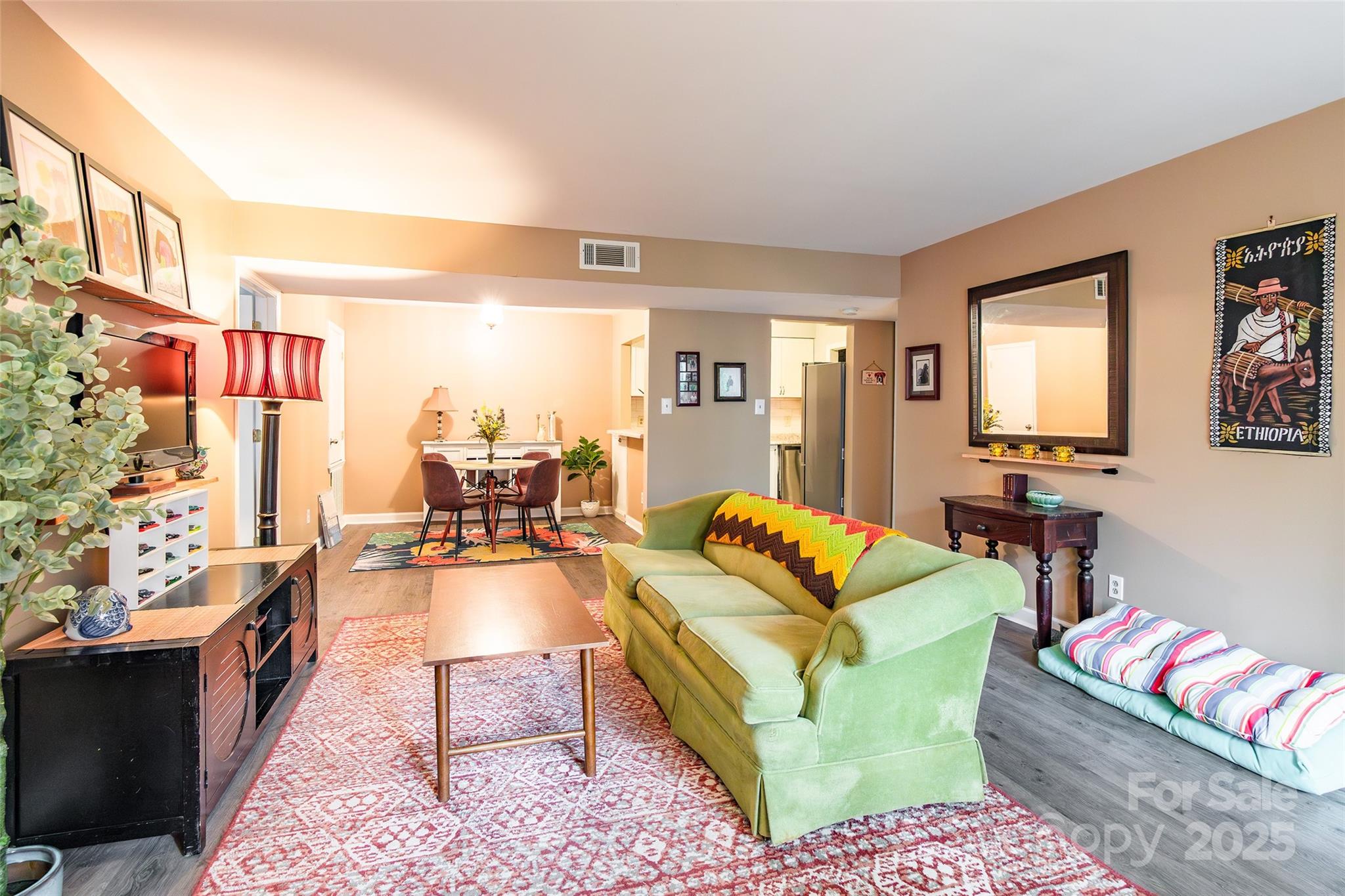 1604 Sharon Road West, Unit 23 Charlotte, NC 28210 - Photo 6 of 21 a living room with furniture fireplace and a large window