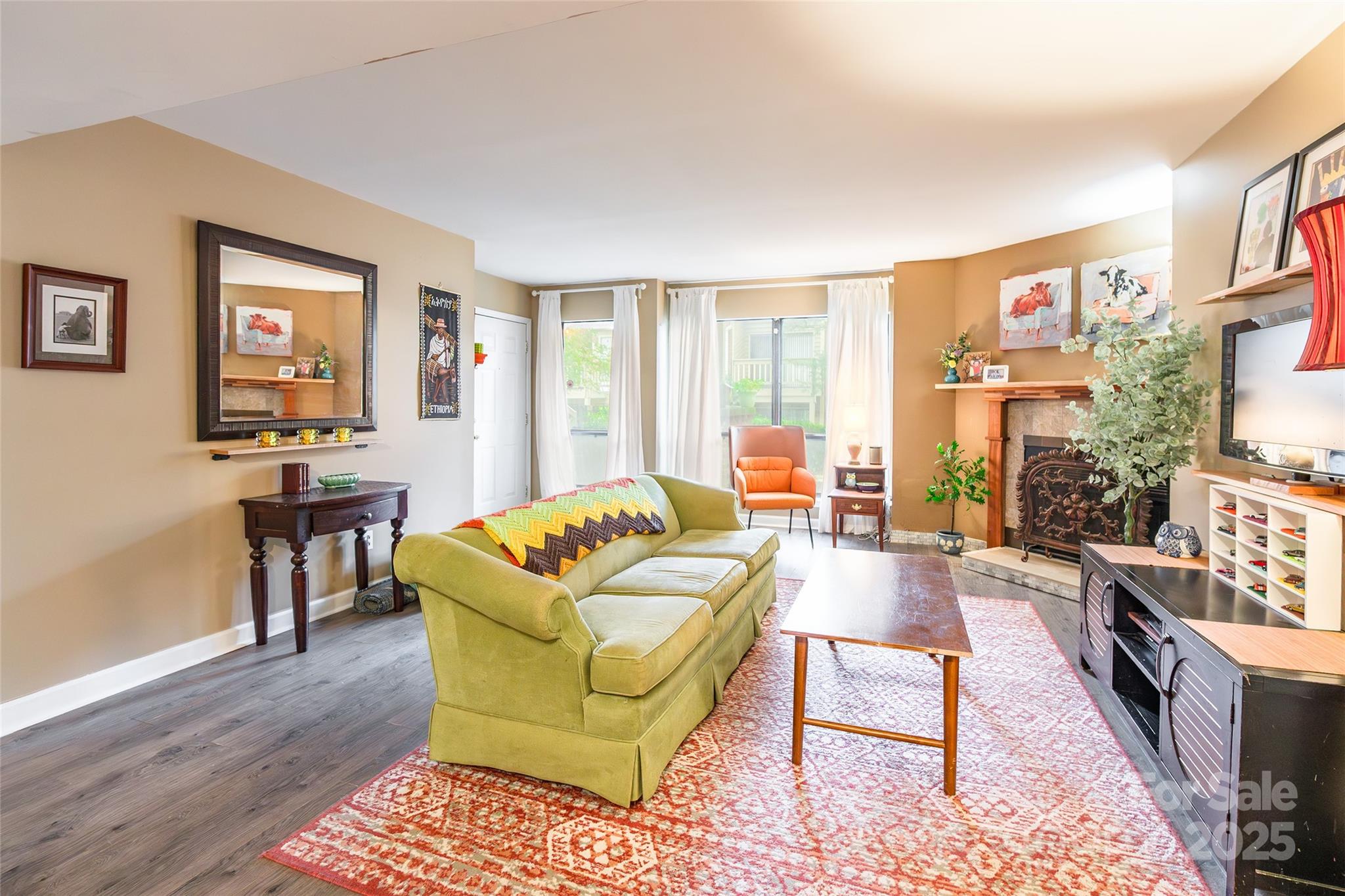 1604 Sharon Road West, Unit 23 Charlotte, NC 28210 - Photo 7 of 21 a living room with furniture and a large window