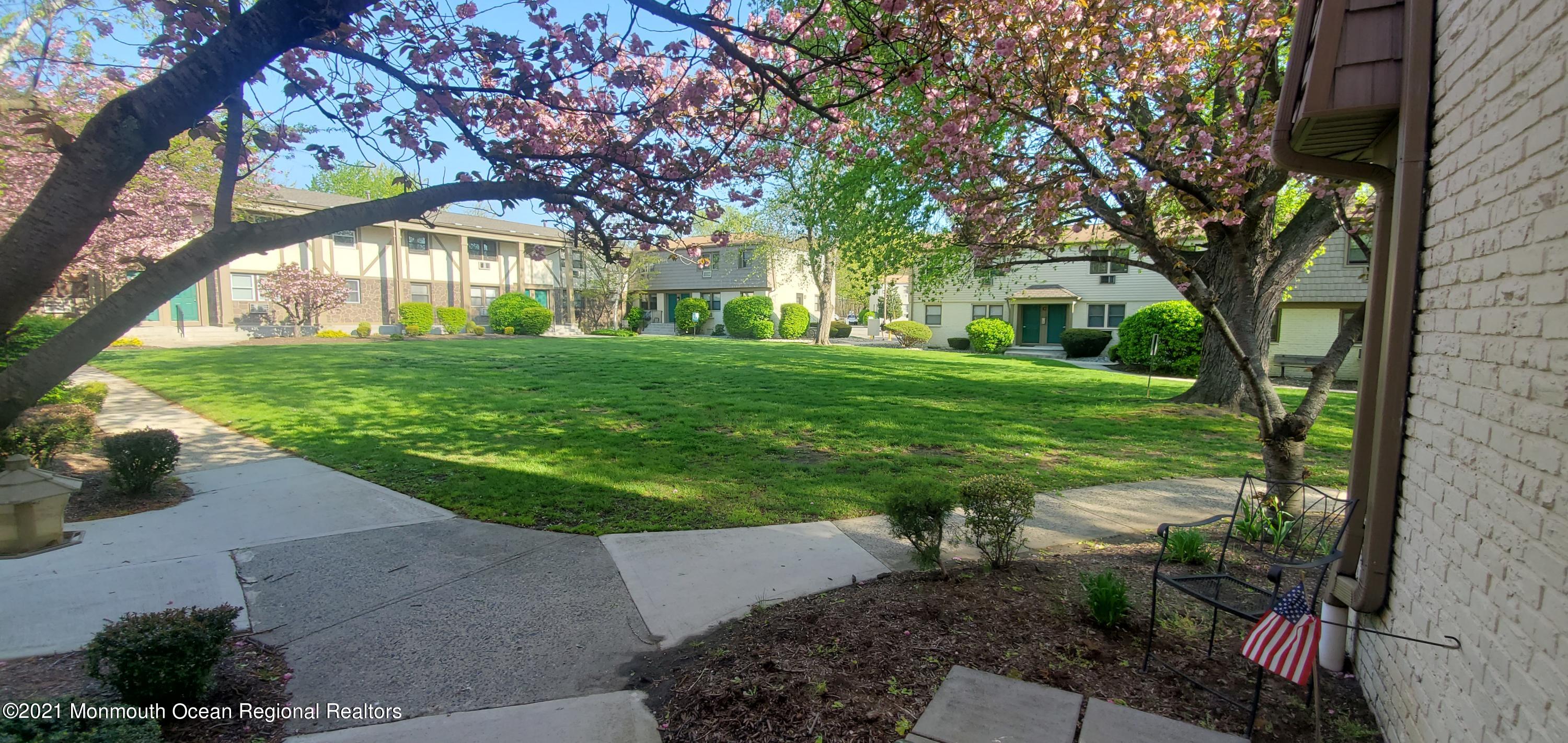 a view of a big yard next to a house