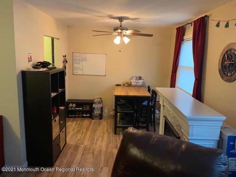400 Cross Road, Unit A7 Matawan, NJ 07747 - Photo 9 of 10 a living room with furniture and a flat screen tv