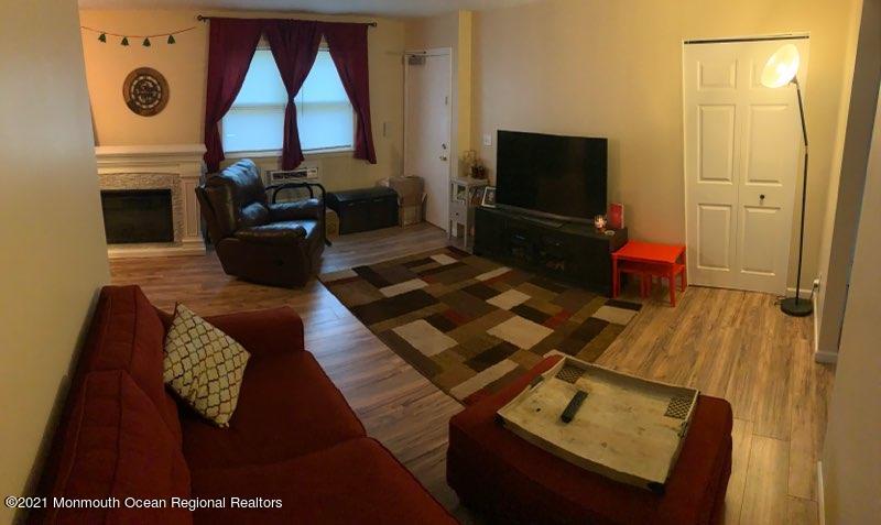 400 Cross Road, Unit A7 Matawan, NJ 07747 - Photo 10 of 10 a living room with furniture and a flat screen tv