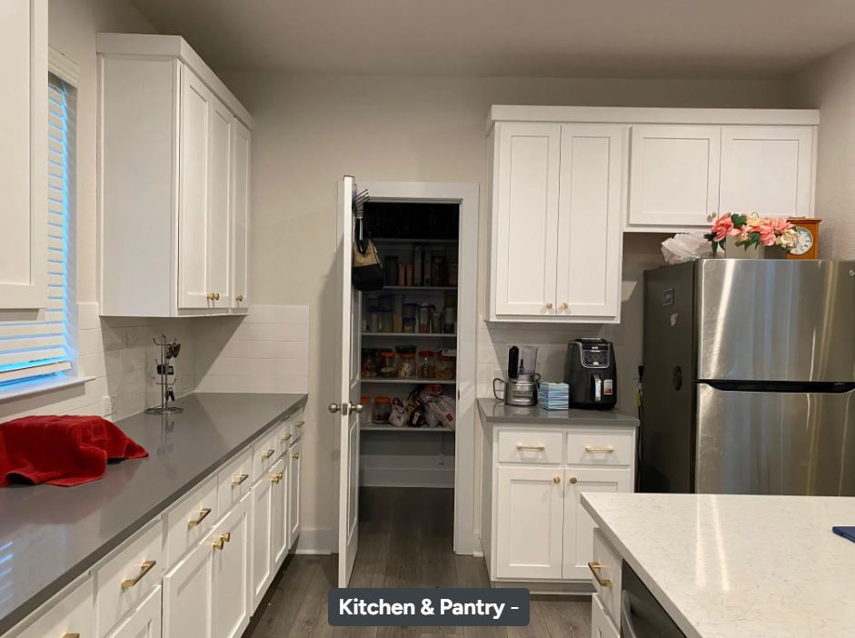4308 Trey Edsel Drive Pflugerville, TX 78660 - Photo 12 of 22 a kitchen with a refrigerator a stove a sink and white cabinets