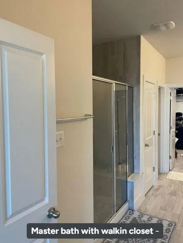 a view of a house with a wooden fence