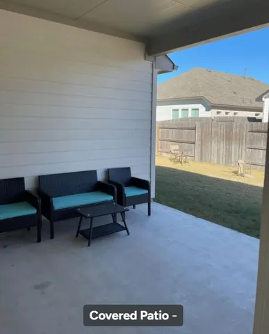 a house view with a backyard space