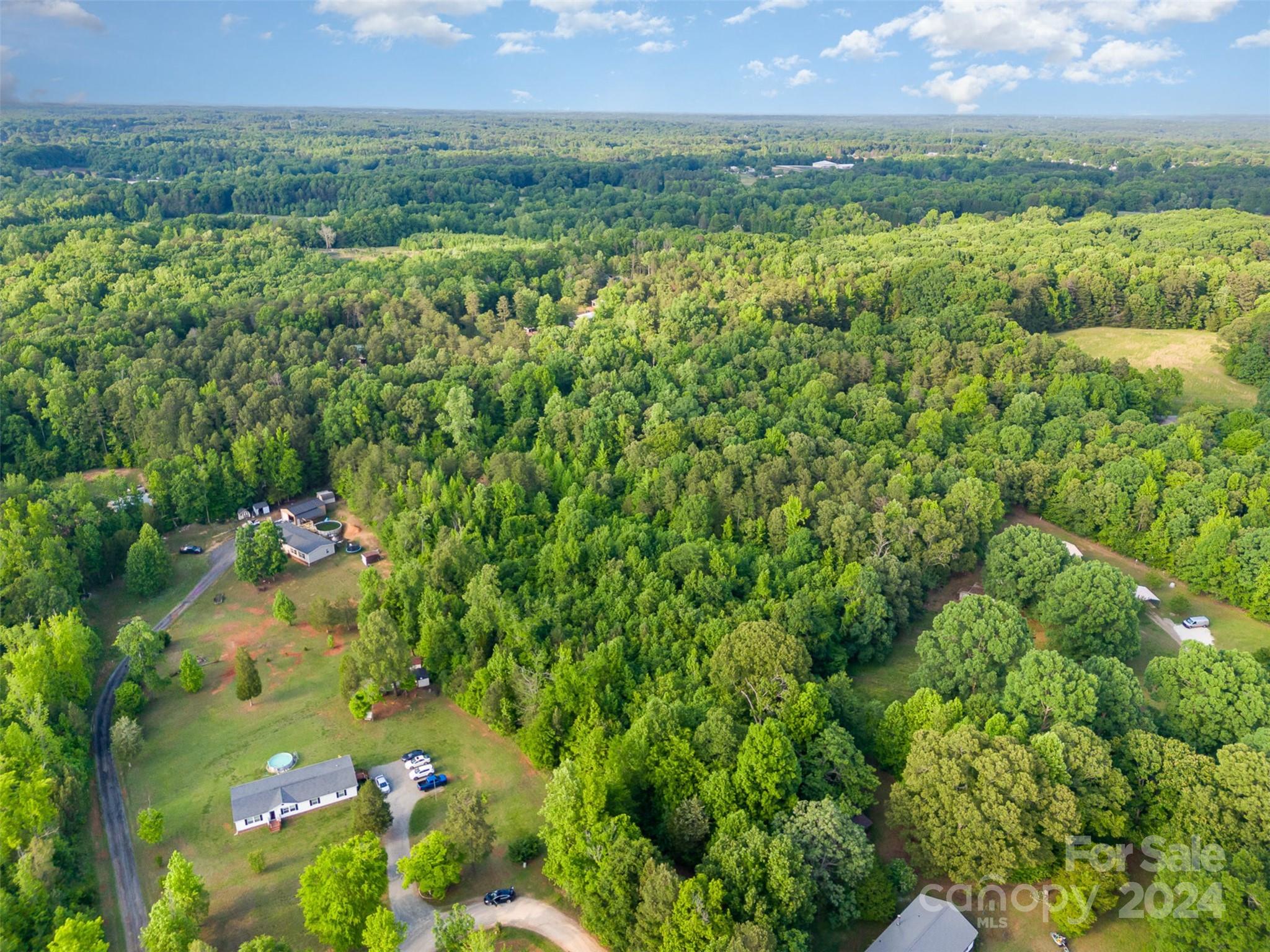 6720 Tuckaseegee Road Kannapolis, NC 28081 - Photo 11 of 16 a view of a lush green field