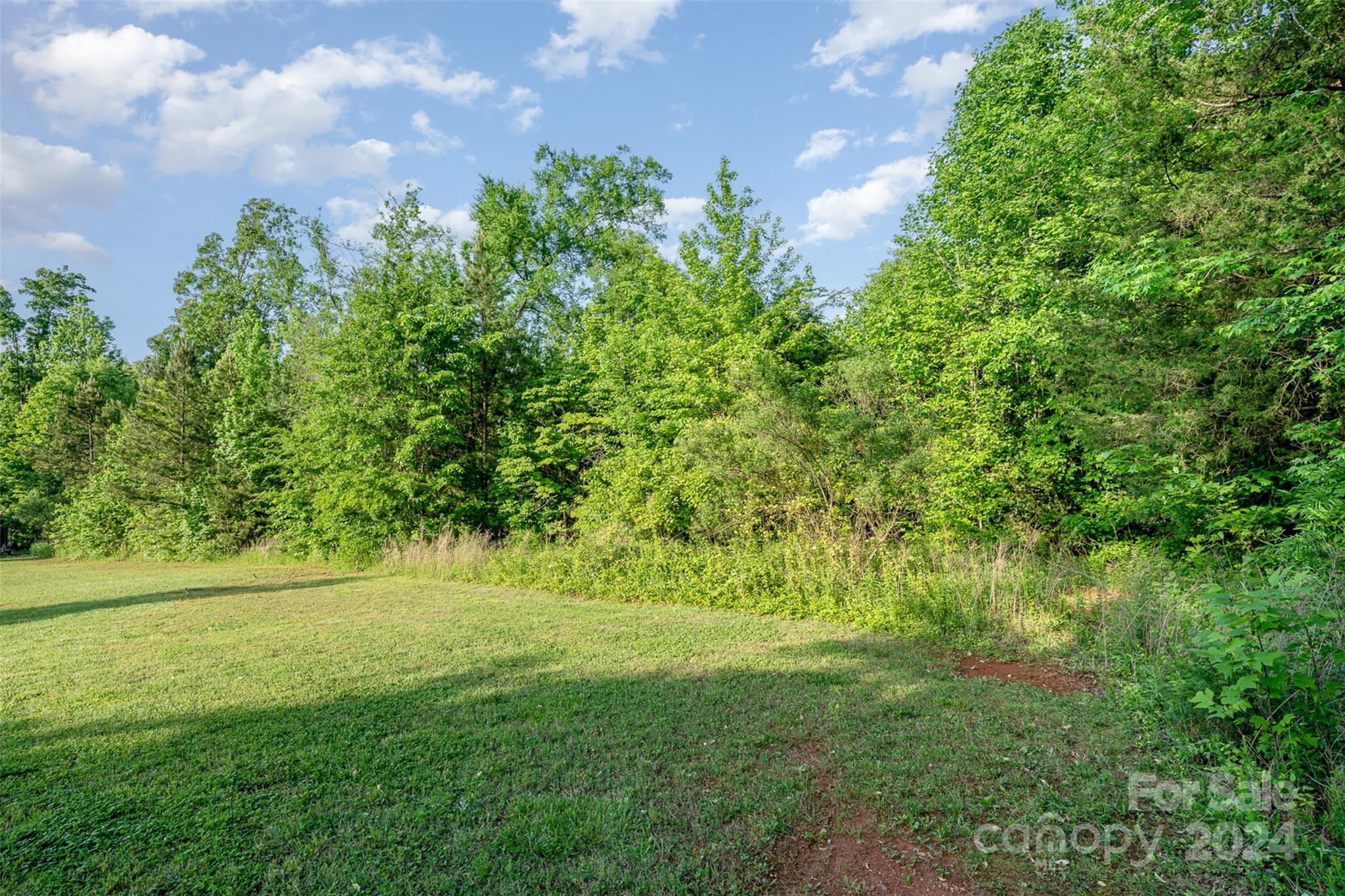 6720 Tuckaseegee Road Kannapolis, NC 28081 - Photo 3 of 16 a view of a lush green space