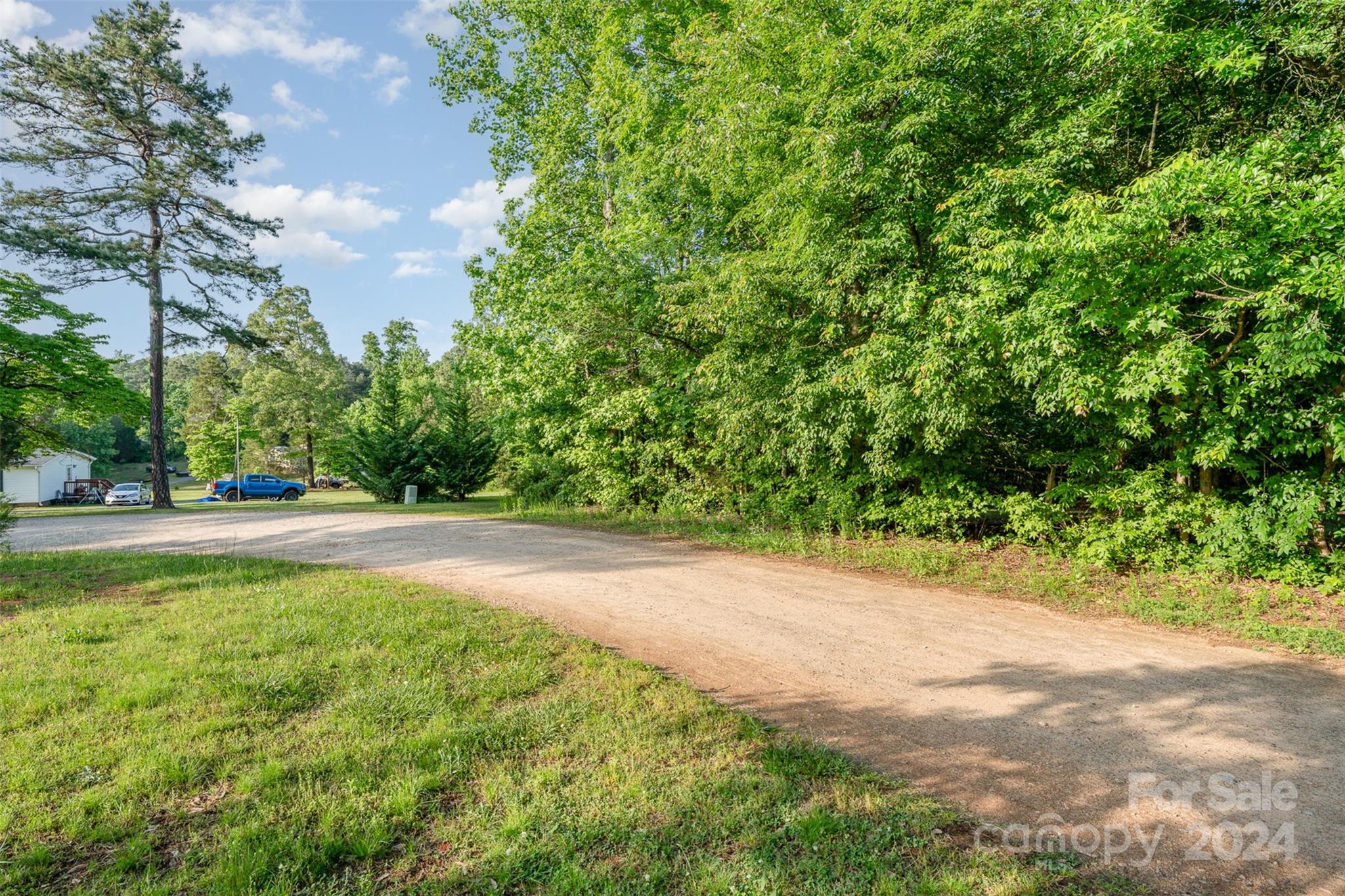 6720 Tuckaseegee Road Kannapolis, NC 28081 - Photo 4 of 16 a view of a yard with plants and trees