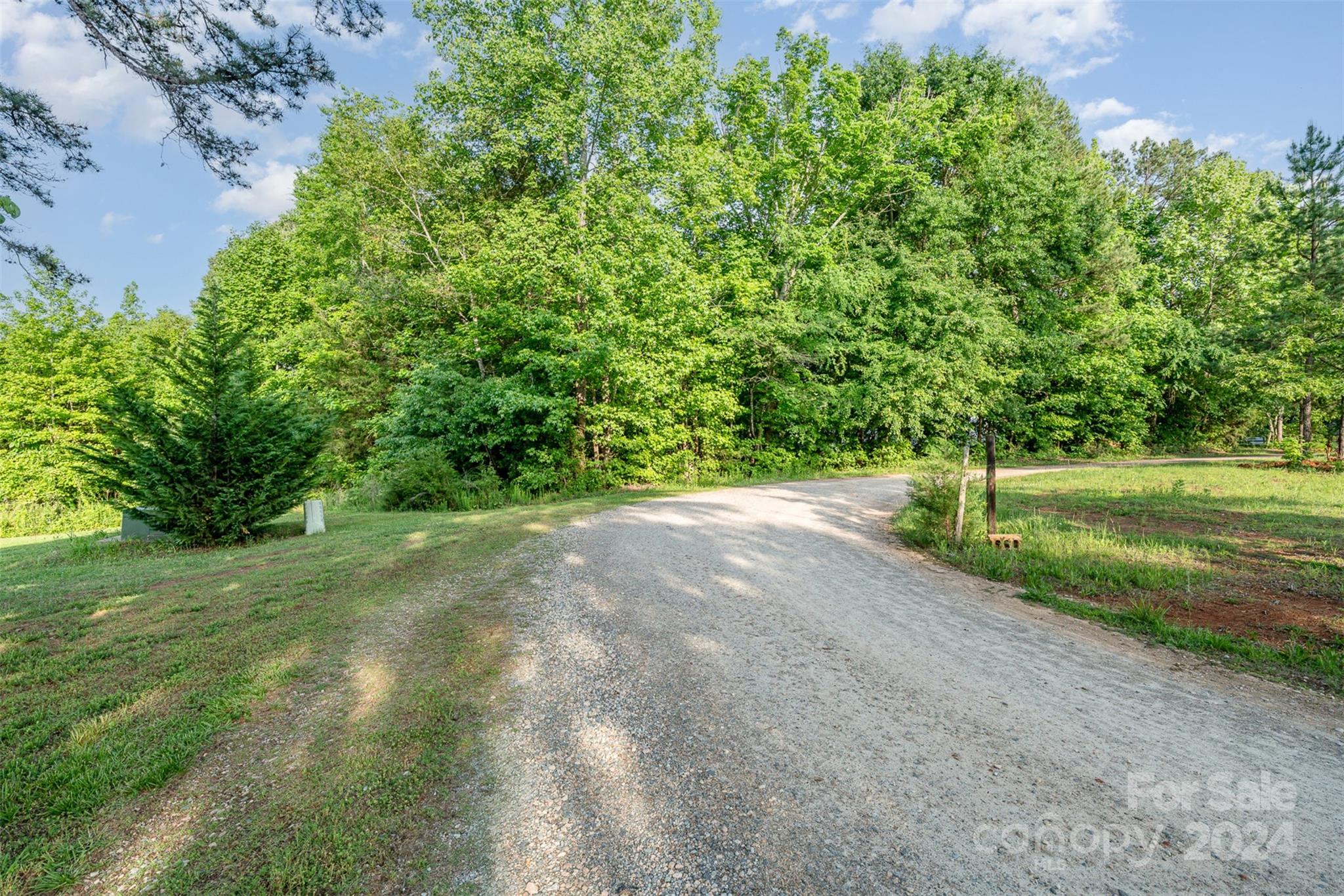 6720 Tuckaseegee Road Kannapolis, NC 28081 - Photo 5 of 16 a view of a yard with a tree