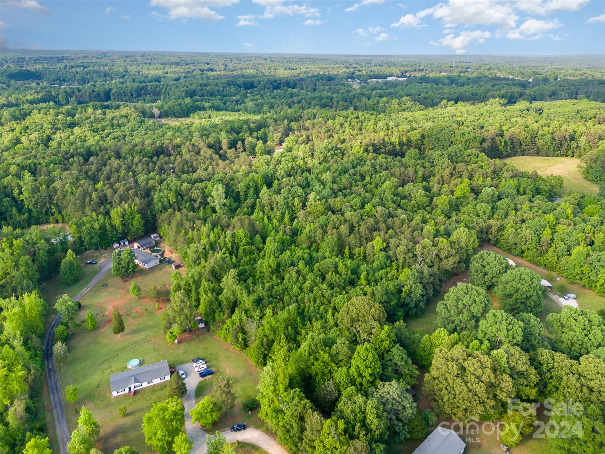 6720 Tuckaseegee Road Kannapolis, NC 28081 - Photo 7 of 16 a view of a lush green field