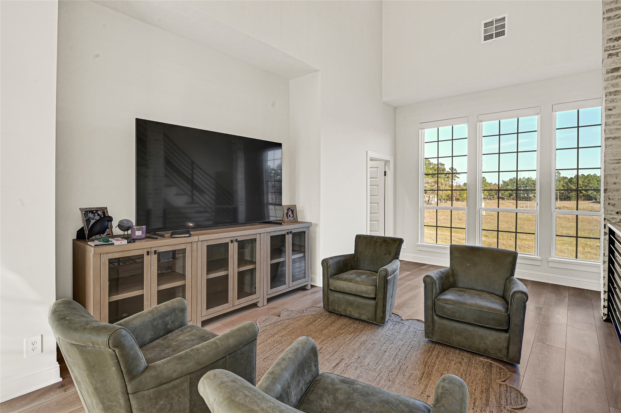 28811 Riley Road Waller, TX 77484 - Photo 35 of 50 a living room with furniture and a flat screen tv