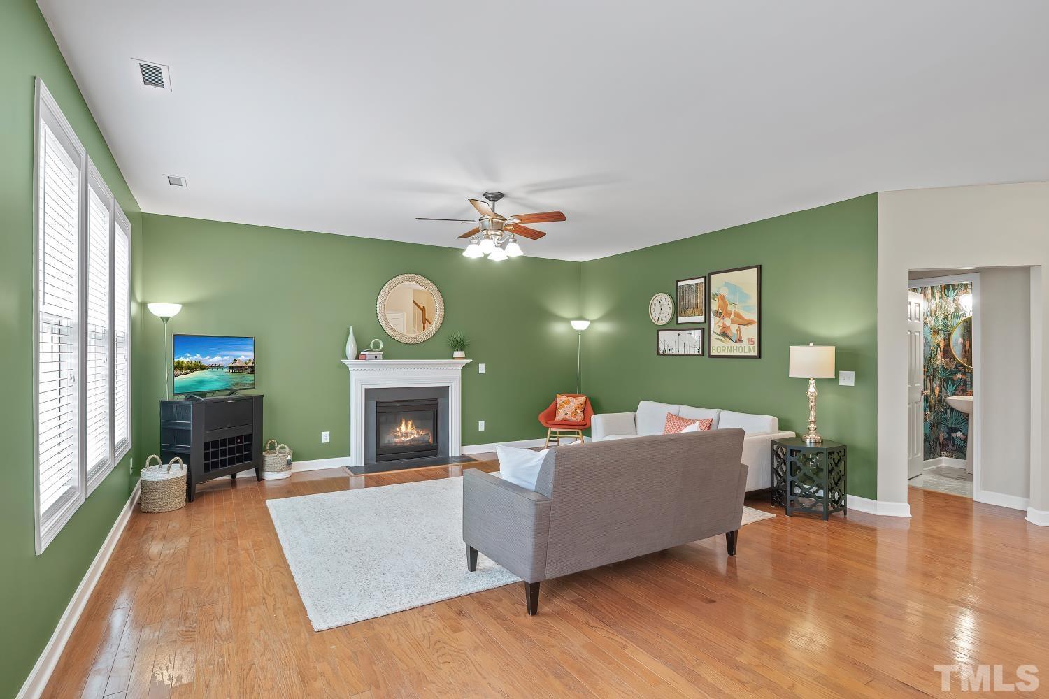 5225 Holly Ridge Farm Road Raleigh, NC 27616 - Photo 11 of 61 a living room with furniture and a fireplace