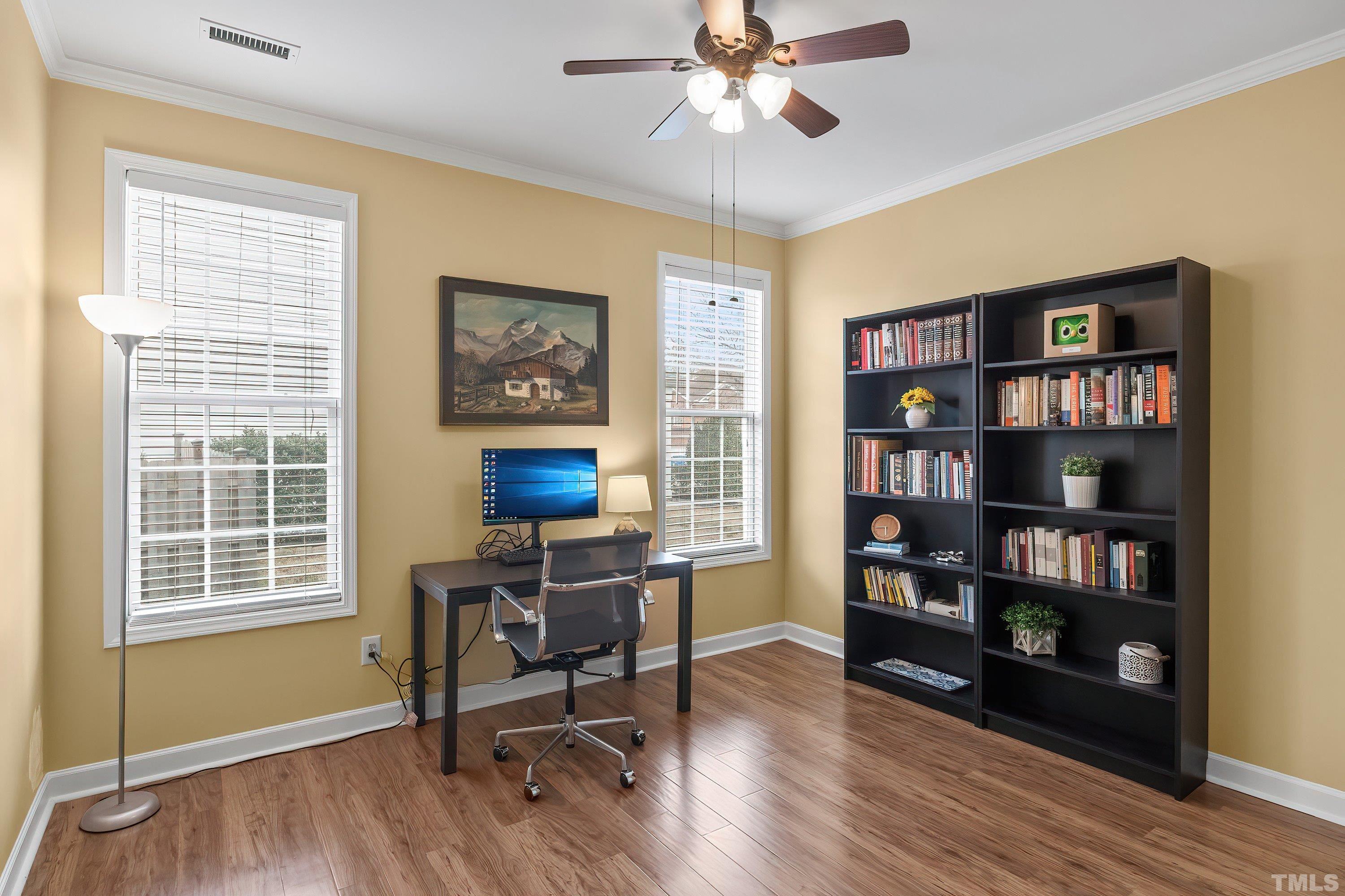 5225 Holly Ridge Farm Road Raleigh, NC 27616 - Photo 22 of 61 a view of a workspace with furniture and a window