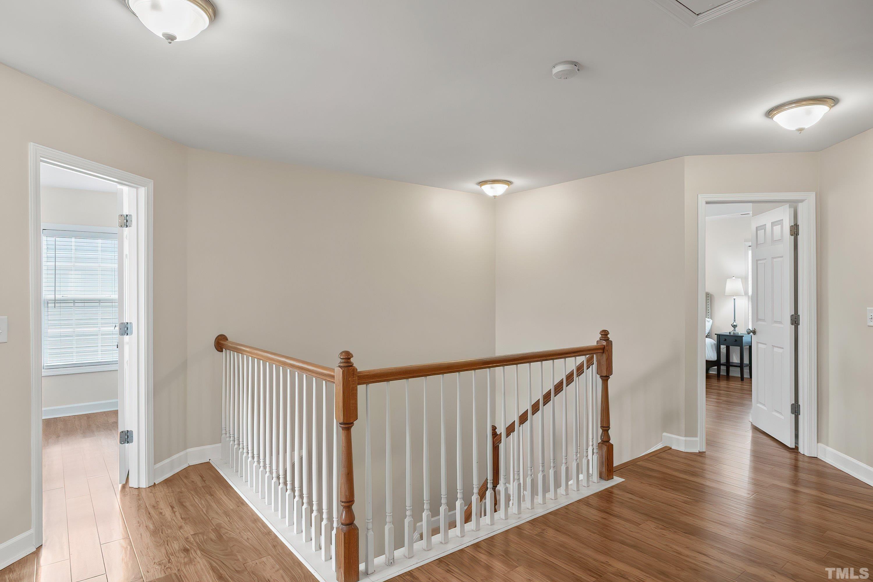 5225 Holly Ridge Farm Road Raleigh, NC 27616 - Photo 24 of 61 a view of a hallway with wooden floor and windows