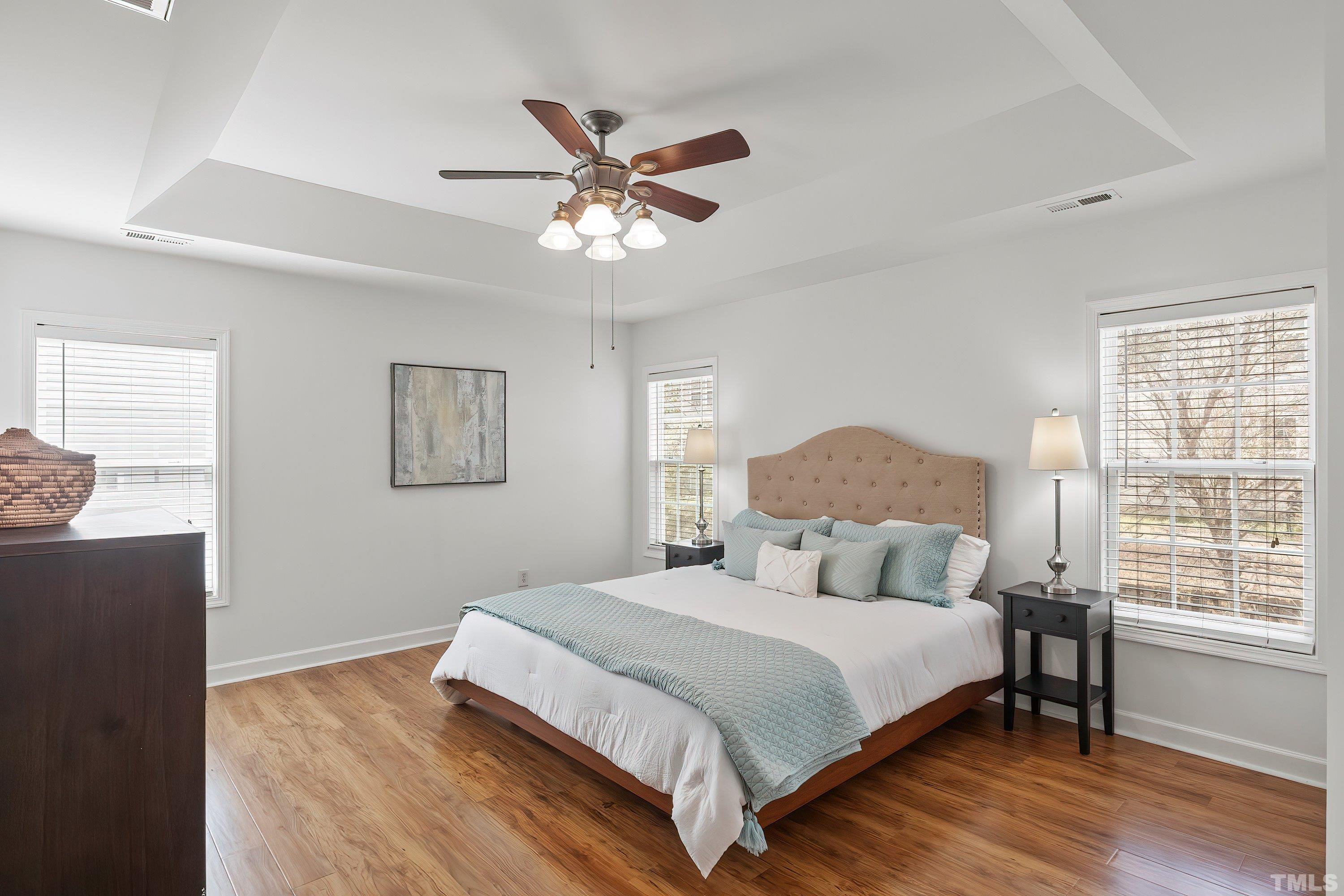 5225 Holly Ridge Farm Road Raleigh, NC 27616 - Photo 25 of 61 a bedroom with a large bed and a window