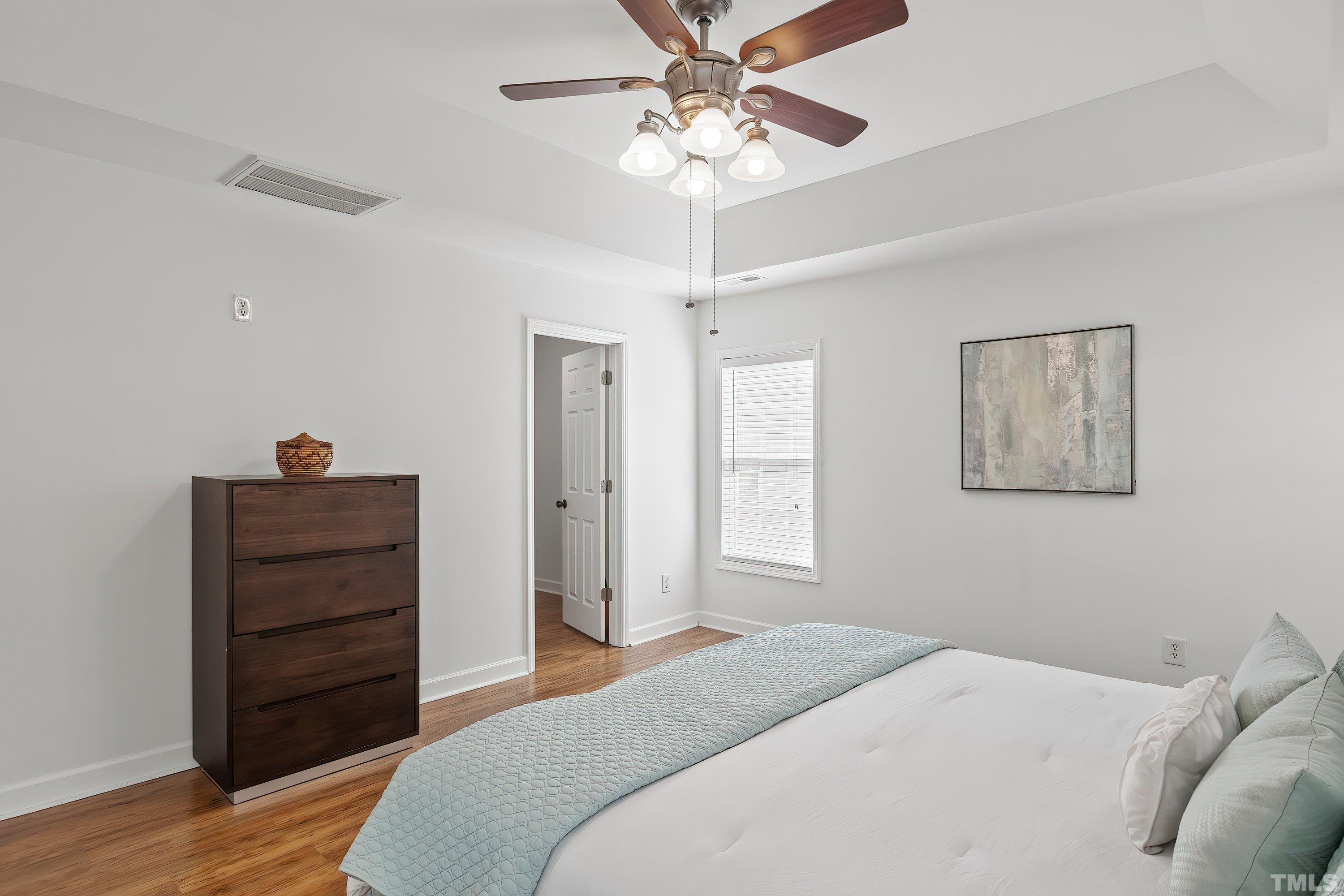 5225 Holly Ridge Farm Road Raleigh, NC 27616 - Photo 28 of 61 a bedroom with a bed and a dresser