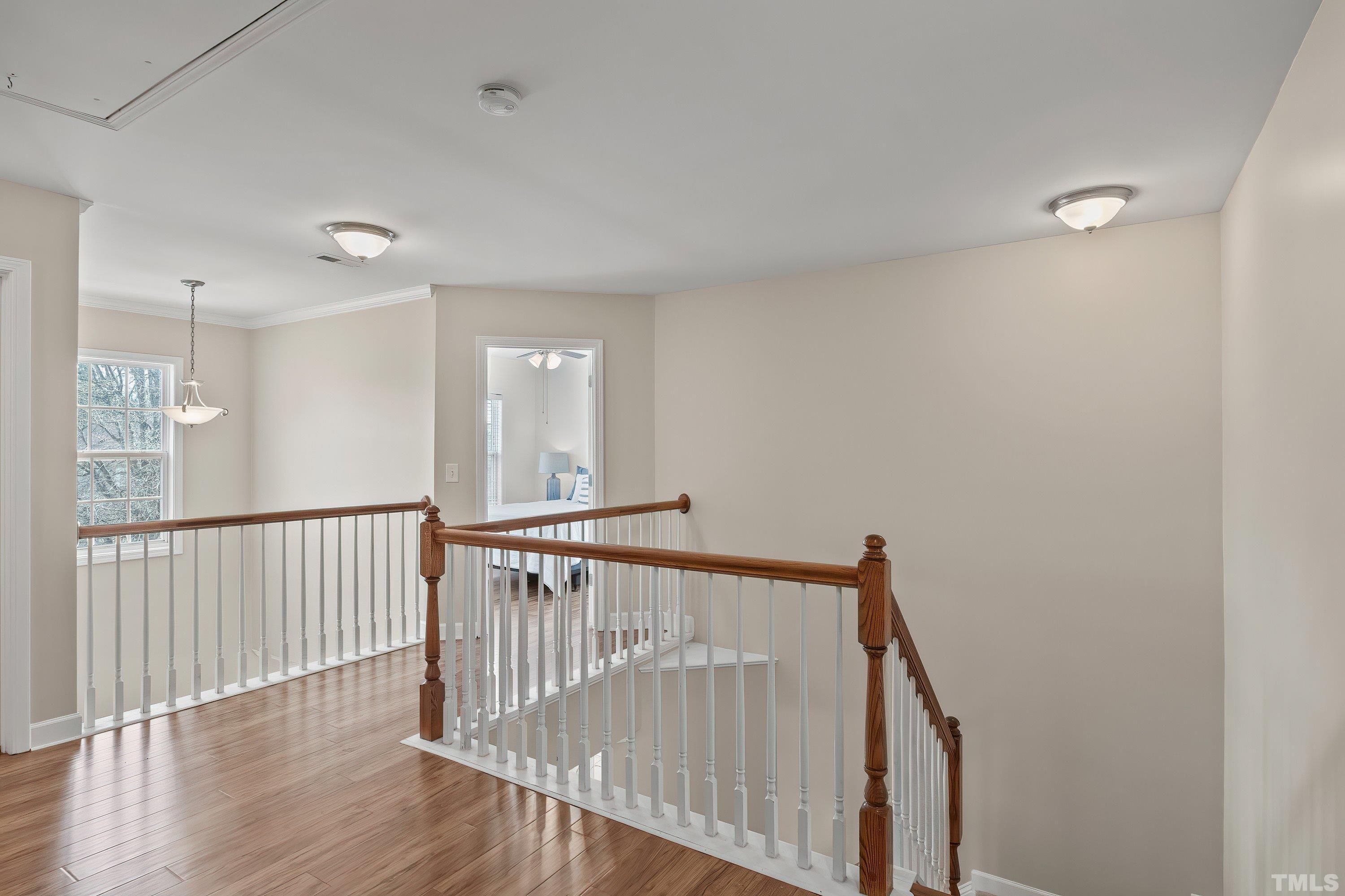 5225 Holly Ridge Farm Road Raleigh, NC 27616 - Photo 33 of 61 a view of hallway with wooden floor