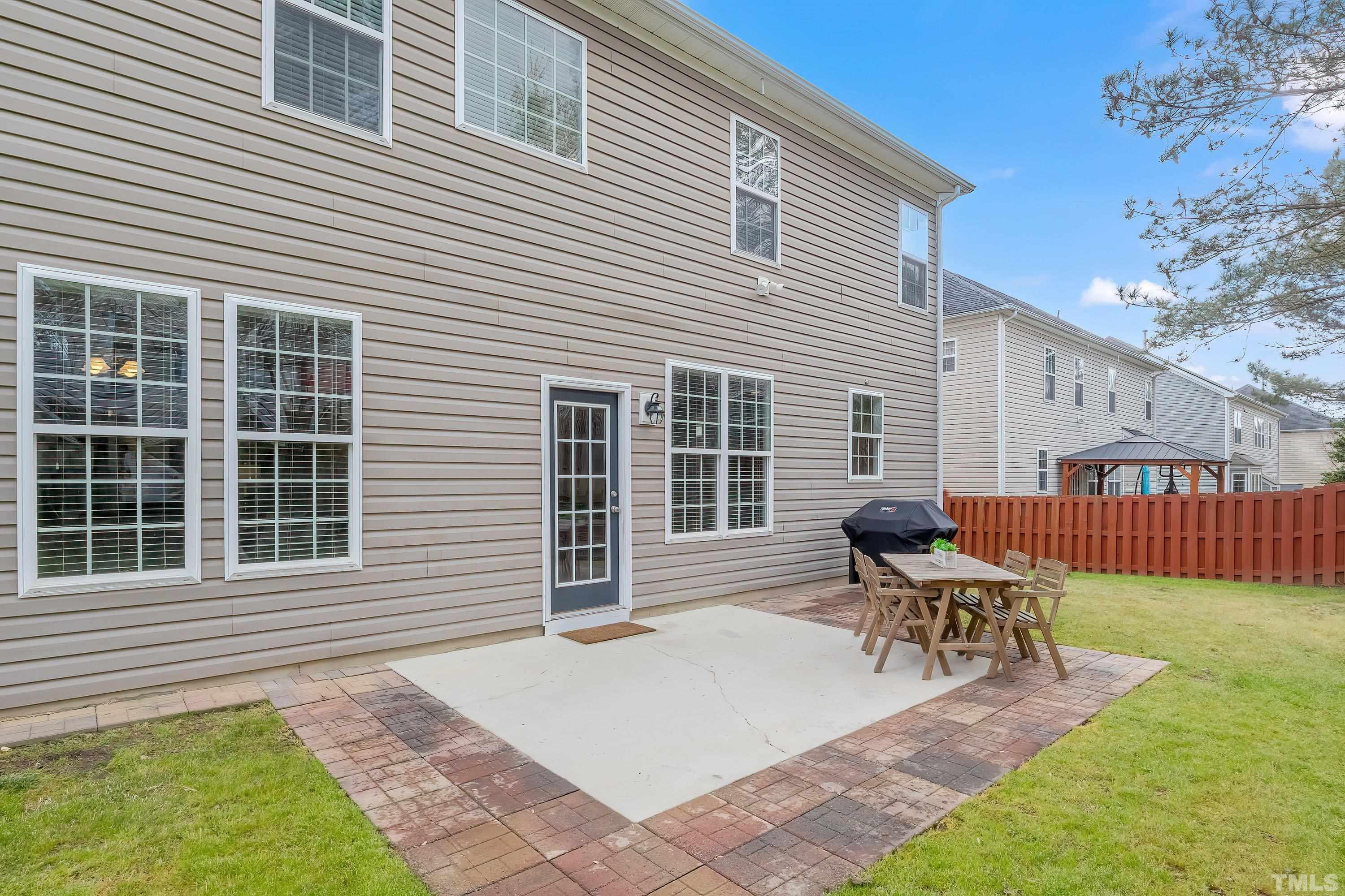 5225 Holly Ridge Farm Road Raleigh, NC 27616 - Photo 42 of 61 a house view with a sitting space and garden