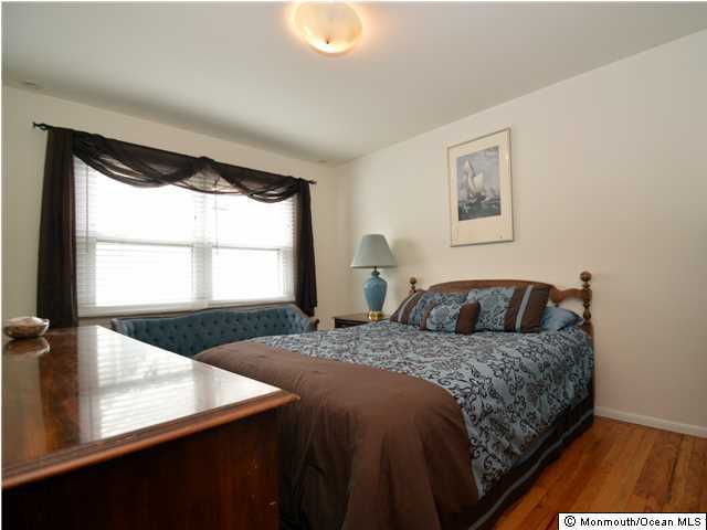 201 Forman Avenue Point Pleasant Beach, NJ 08742 - Photo 12 of 25 a bedroom with a bed and a window