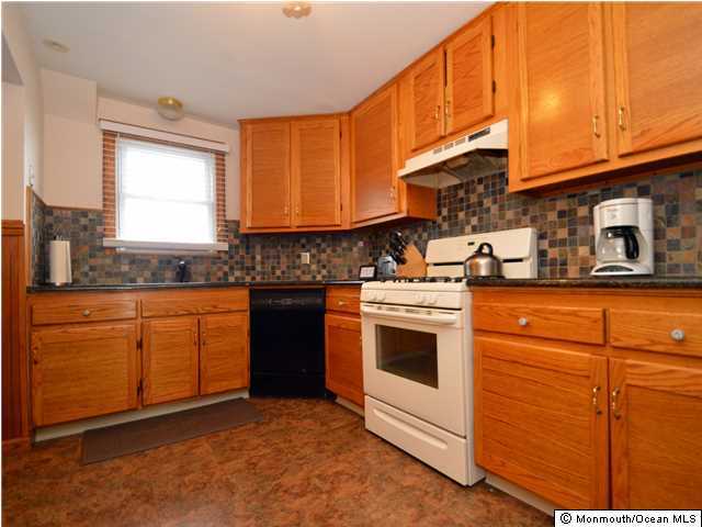 201 Forman Avenue Point Pleasant Beach, NJ 08742 - Photo 18 of 25 a kitchen with stainless steel appliances granite countertop a stove a sink and a microwave