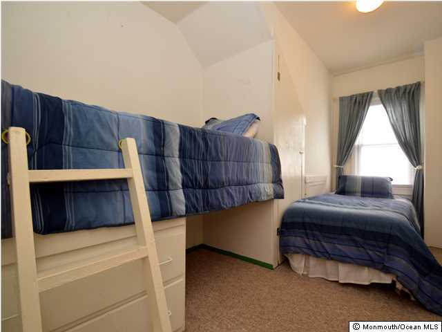 201 Forman Avenue Point Pleasant Beach, NJ 08742 - Photo 23 of 25 a bedroom with a bed and window