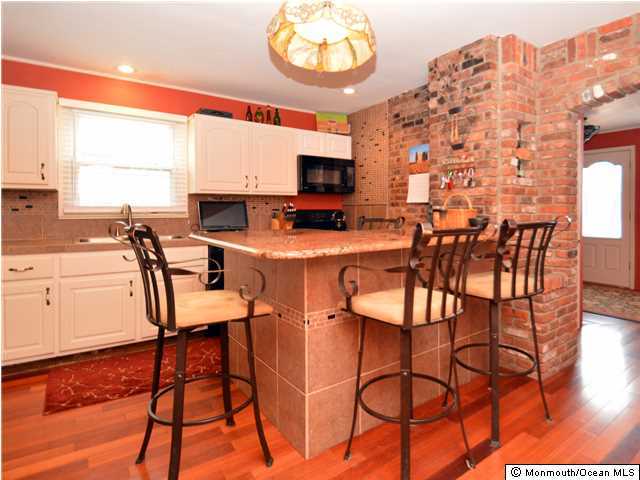 201 Forman Avenue Point Pleasant Beach, NJ 08742 - Photo 3 of 25 a view of a dining room with furniture and a flat screen tv