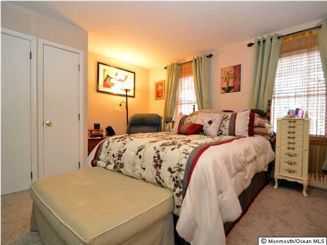 201 Forman Avenue Point Pleasant Beach, NJ 08742 - Photo 7 of 25 a bedroom with a bed and a table