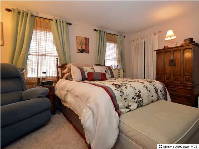 201 Forman Avenue Point Pleasant Beach, NJ 08742 - Photo 8 of 25 a bedroom with a bed window and couch