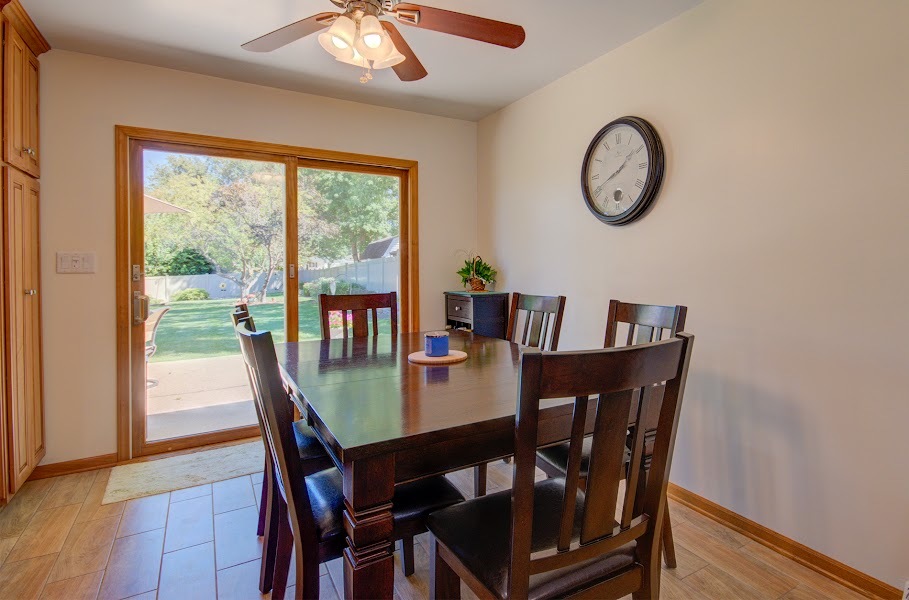 23019 South Kent Road Channahon, IL 60410 - Photo 19 of 36 a view of a dining room with furniture window and wooden floor