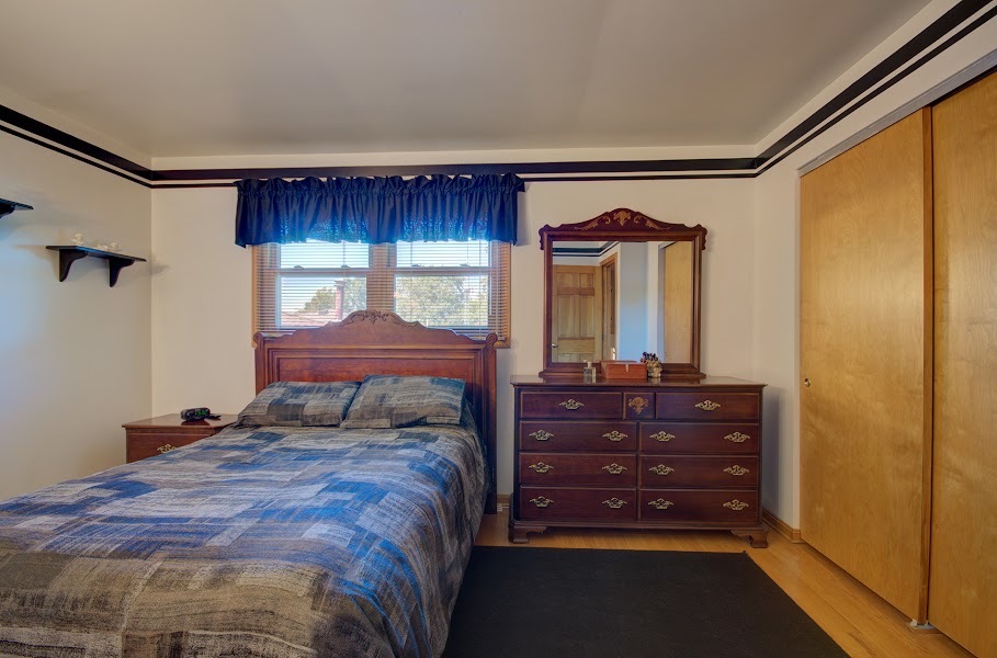 23019 South Kent Road Channahon, IL 60410 - Photo 27 of 36 a bedroom with a bed and a mirror on dresser