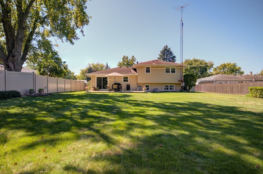 23019 South Kent Road Channahon, IL 60410 - Photo 5 of 36 a view of a house with a big yard and potted plants