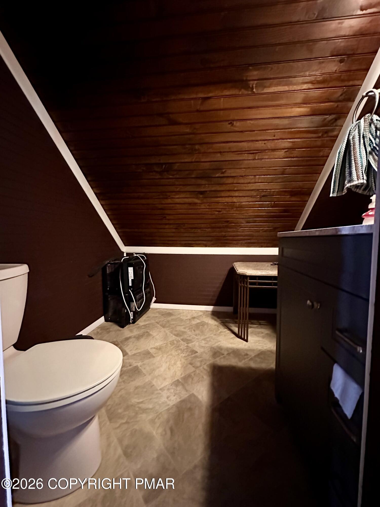 1173 Coolbaugh Road East Stroudsburg, PA 18302 - Photo 25 of 34 a bathroom with a toilet and a mirror