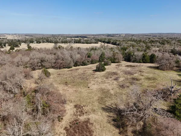 a view of a lake with houses in the back