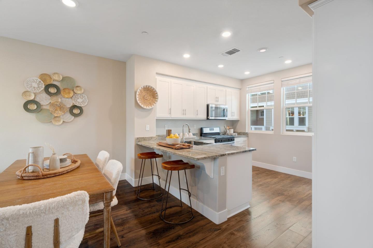 3911 Degree Lane Mountain View, CA 94043 - Photo 13 of 54 a kitchen with a stove a refrigerator and a dining table