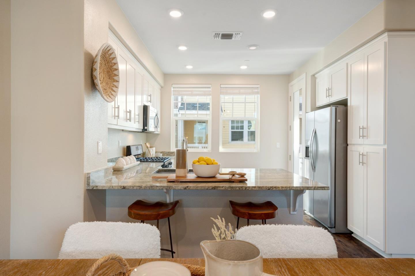 3911 Degree Lane Mountain View, CA 94043 - Photo 14 of 54 a dining room with stainless steel appliances furniture a window and kitchen view