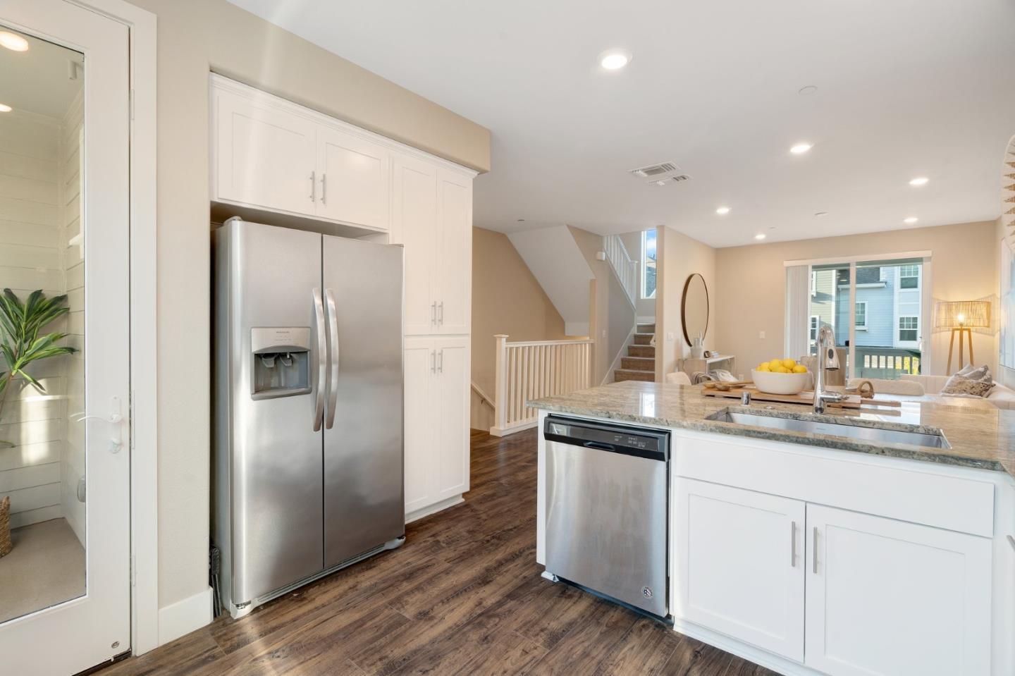 3911 Degree Lane Mountain View, CA 94043 - Photo 16 of 54 a kitchen with stainless steel appliances granite countertop a refrigerator a sink and white cabinets