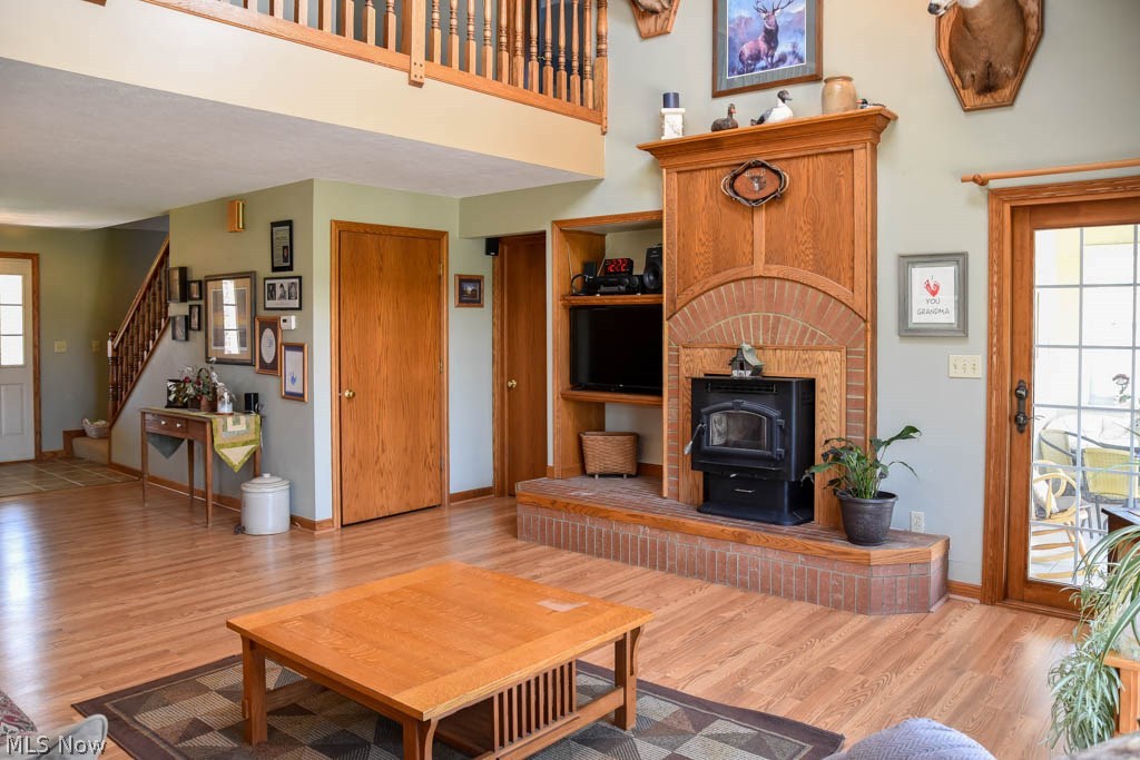 2555 Fixler Road Wadsworth, OH 44281 - Photo 9 of 35 Living room with incredible wood burning, brick fireplace.