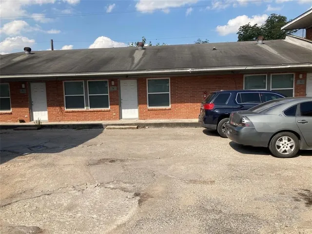a car parked in front of a building
