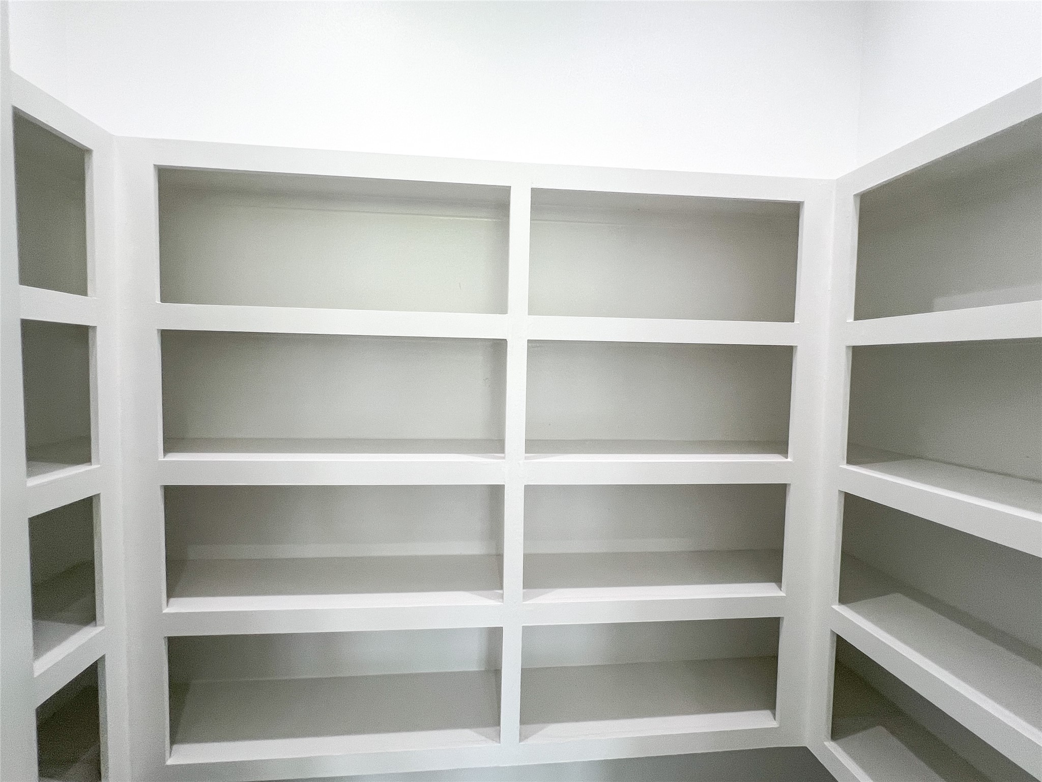 126 Lakeland Circle Rosharon, TX 77583 - Photo 18 of 49 a view of walk in closet with empty racks