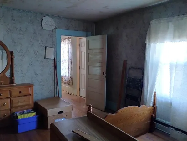 an empty room with wooden floor
