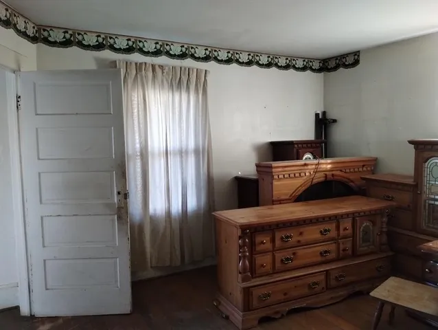 a kitchen with wooden cabinets and a stove top oven