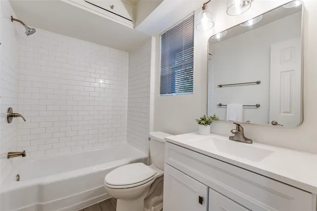 a bathroom with a sink a toilet and a bathtub